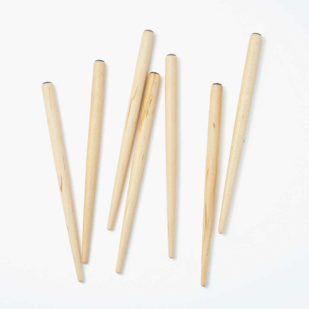Set of wooden nib holders on a white background