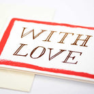 Card with 'WITH LOVE' metallic foiled text and red border on a white background