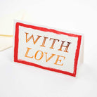 Card with 'WITH LOVE' text and red border on a white background
