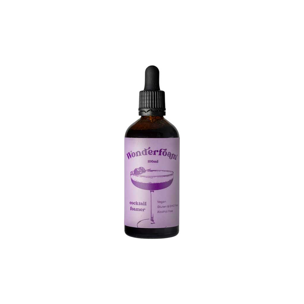 Bottle of wonderfoam cocktail foamer with purple label on white background