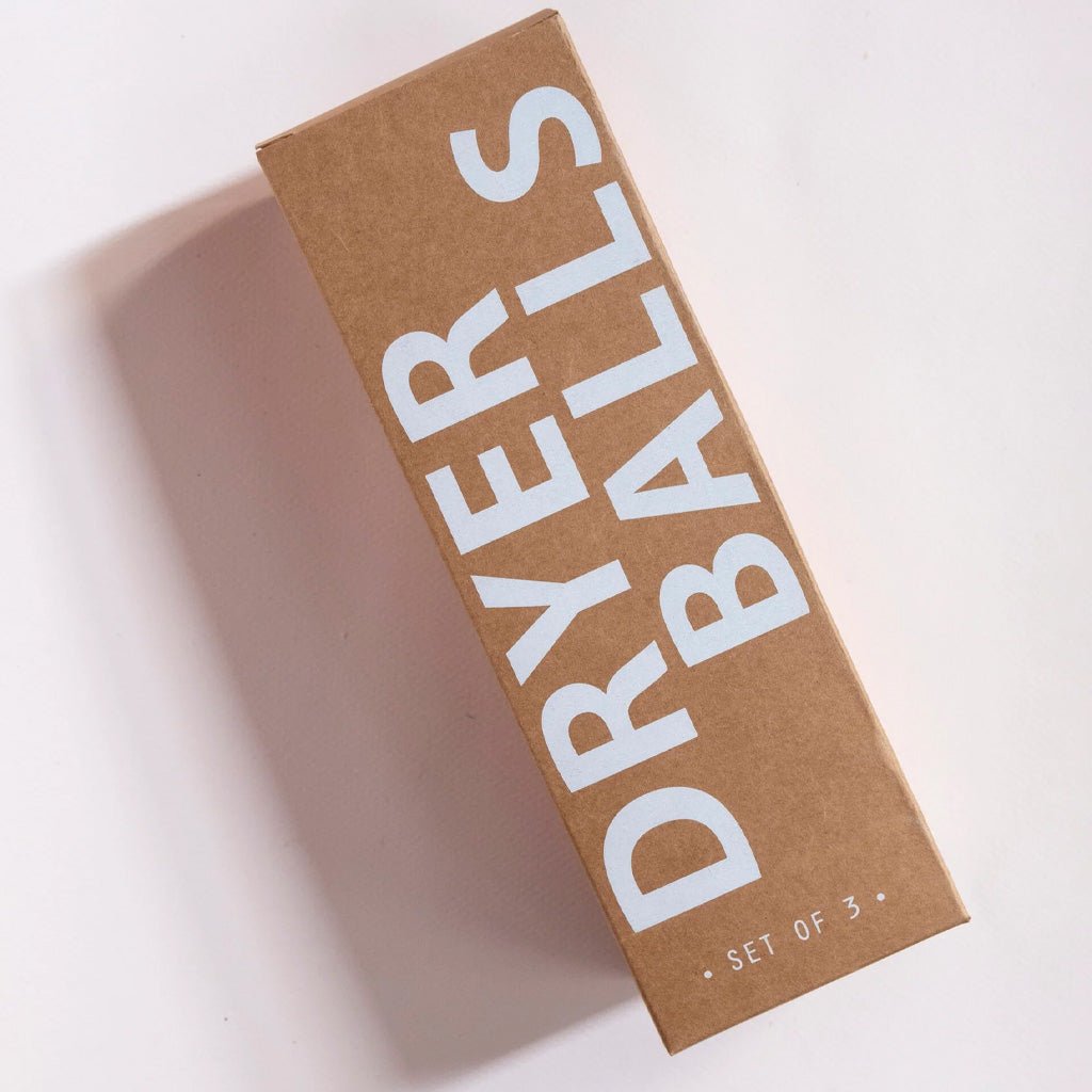 Kraft packaging of dryer balls on white background