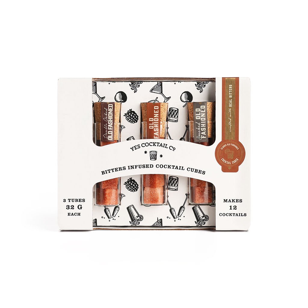 Yes Cocktail Co. Bitters Infused Cocktail Cubes in a white cardboard window box package containing three tubes of cocktail cubes.