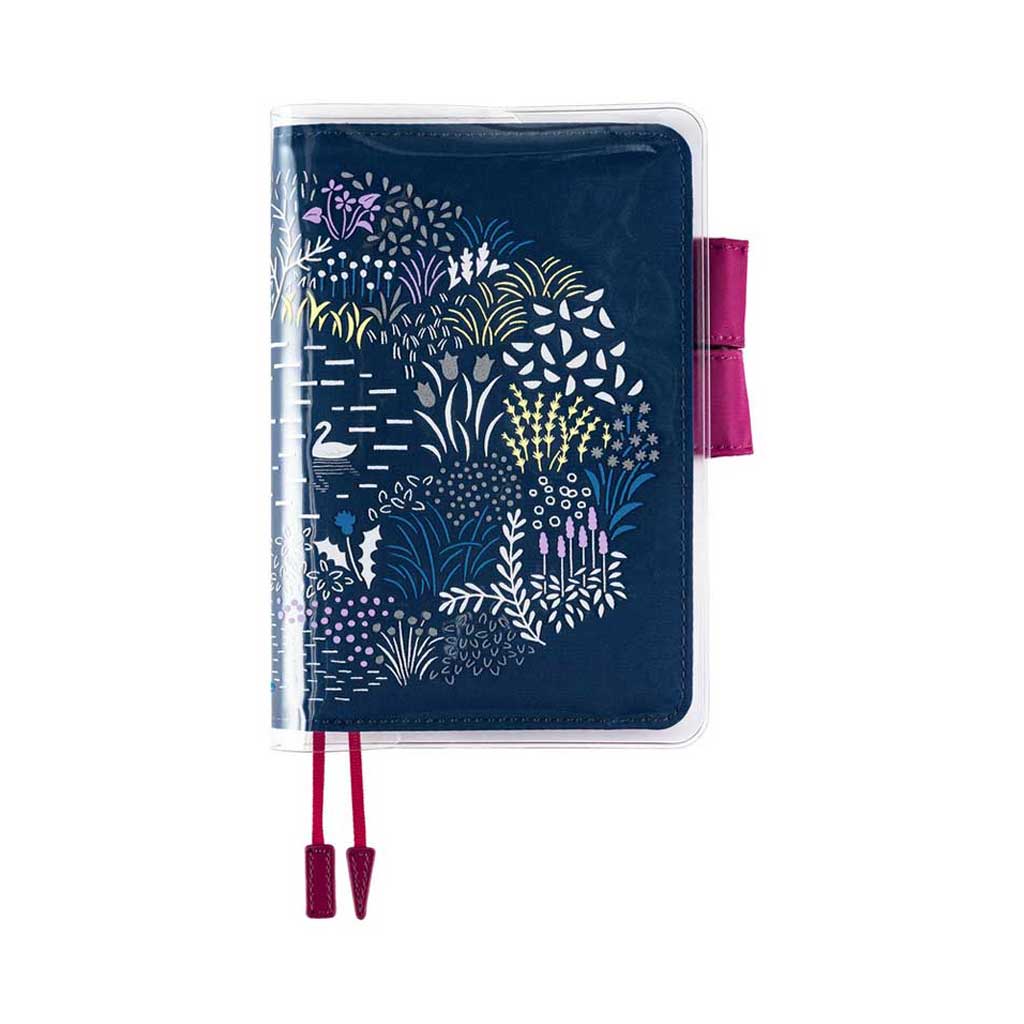 Yuri Sanae clear cover on cover with pastel floral designs on top of Navy A6 Hobonichi Techo cover