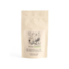 Kraft bag of Yuta's Yabukita matcha green tea by Comins tea on white background