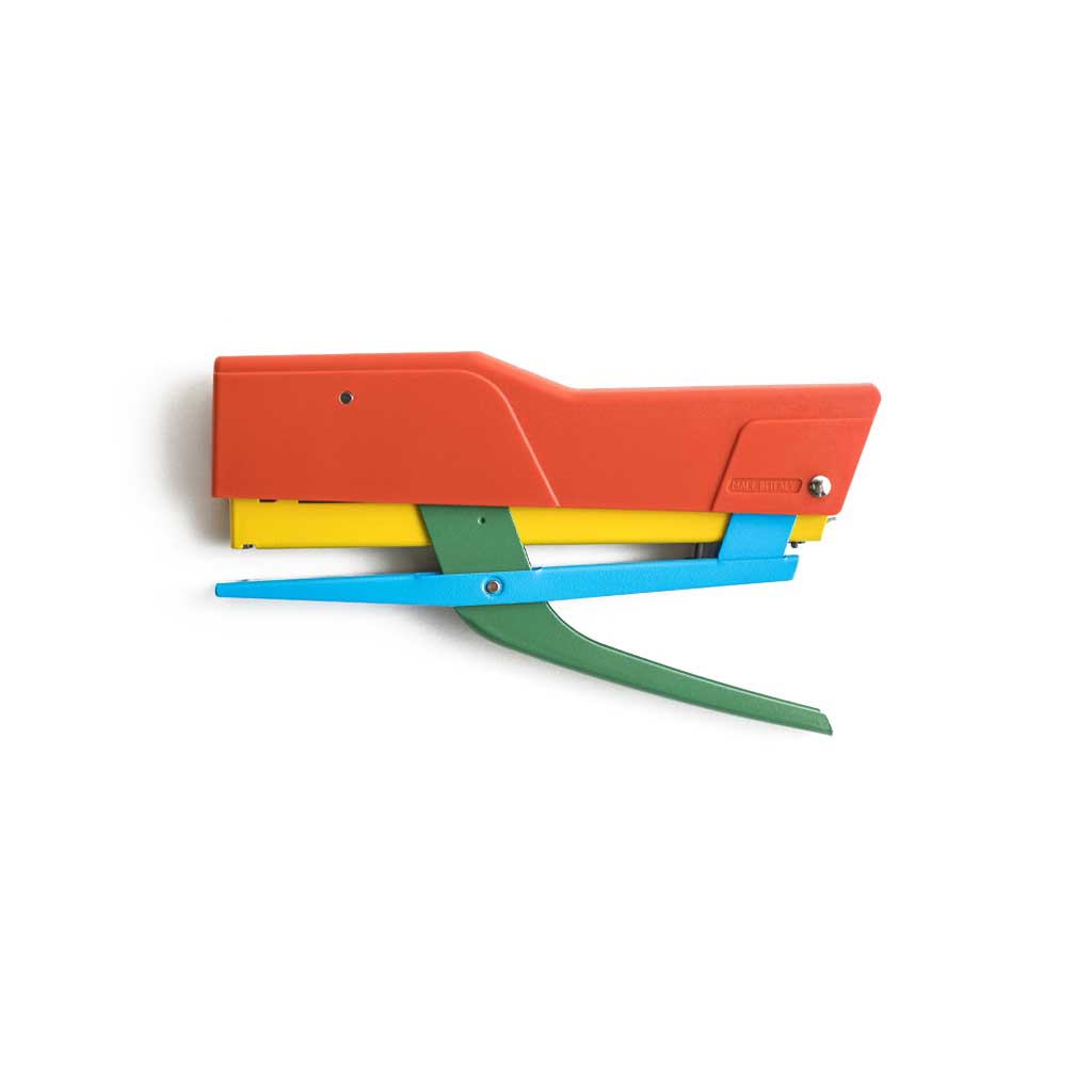 Colorful Zenith handheld stapler with red, yellow, blue, and green components on a white background